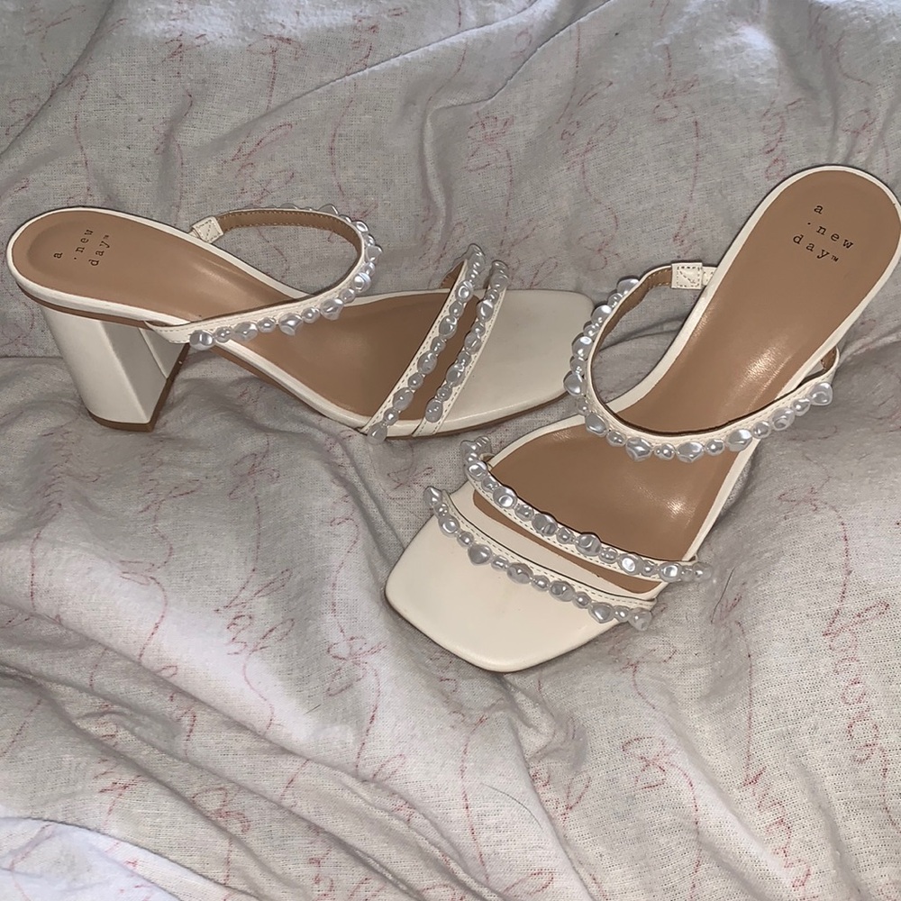 Elegant woman’s pearl heels